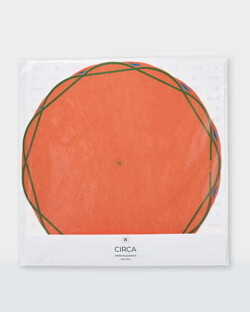 Scalloped Summer paper placemats in blue, green, yellow and coral with contrasting outlines.