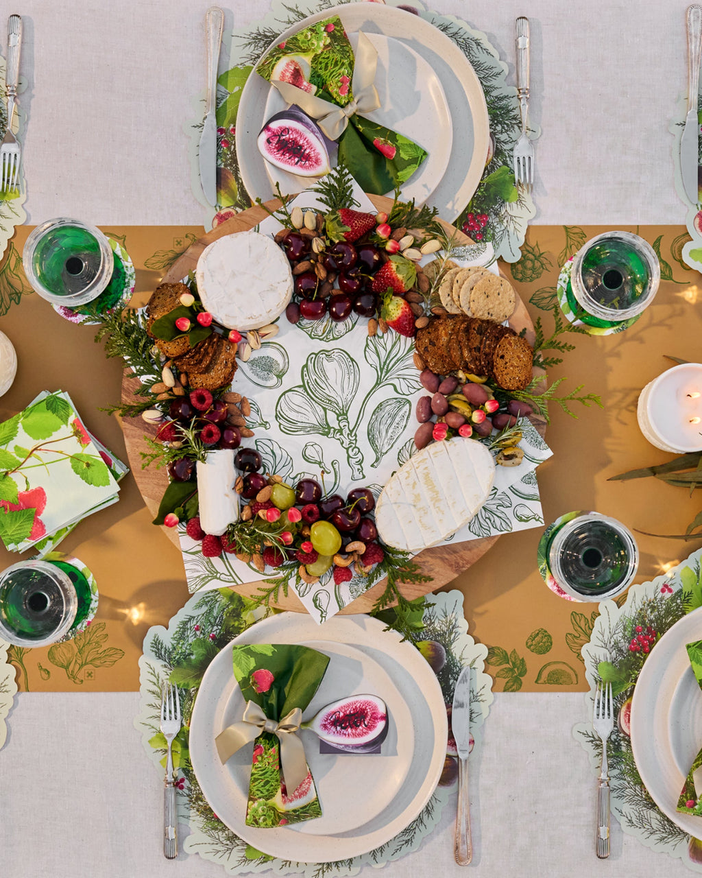 Festive Tableware Pack with green botanical paper tableware and cream bow napkin rings.
