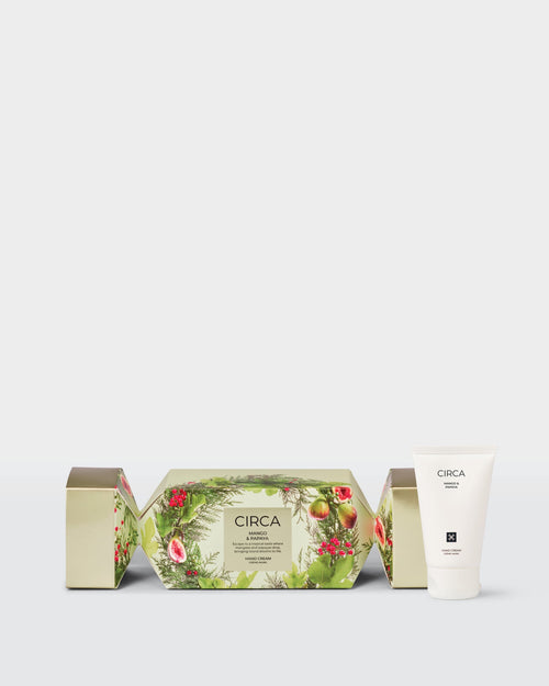 Mango & Papaya 40ml Hand Cream beside front-facing botanical Christmas bonbon packaging.